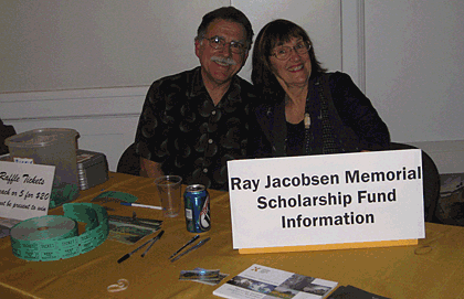 Ed Dufault and Audrey Von Hawley selling raffle tickets at the Arts Guild Tribute